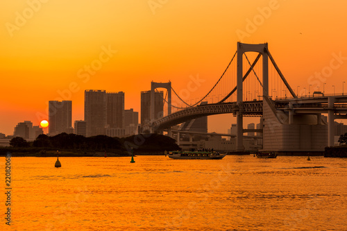 Tokyo skyline and rainbow bridge at sunset in Odaiba waterfront. © kanonsky