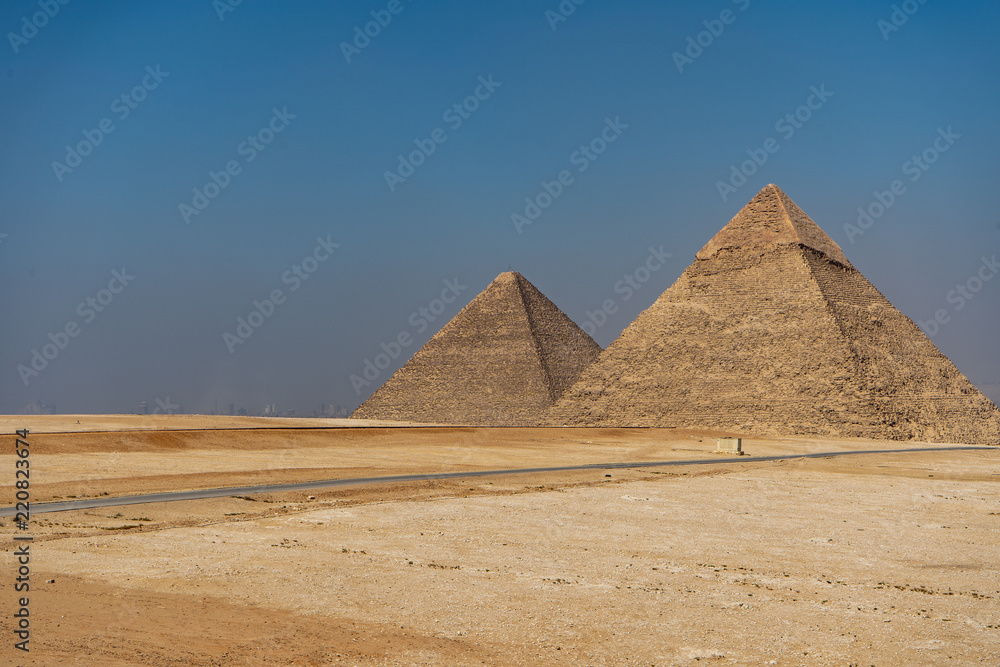 The three pyramids of the Necropolis of Giza, Khufu (Cheops), Khafra and Mankawra, outside Cairo, Egypt. The three pyramids of the Necropolis of Giza, Khufu (Cheops), Khafra and Mankawra, outside Cairo, Egypt.
