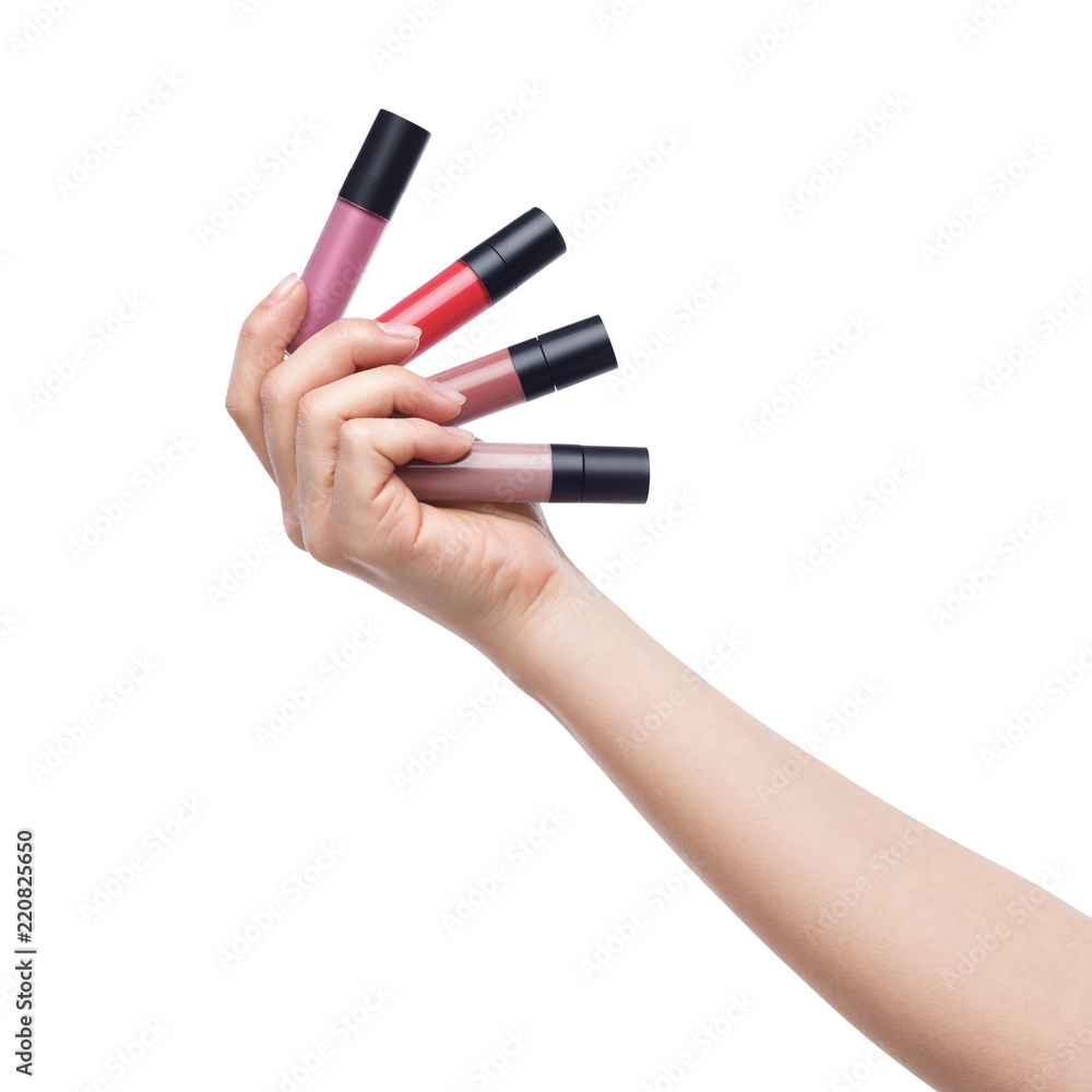 Woman holding various matte lip glosses on white Woman holding various matte lip glosses on white