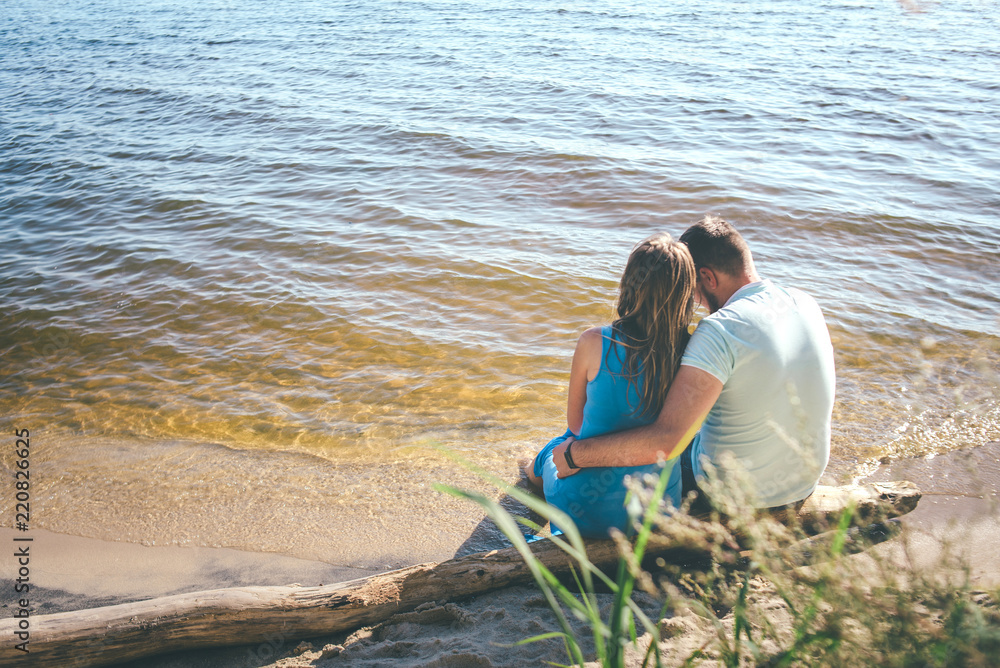 Fototapeta premium couple is hugging sitting to the sun