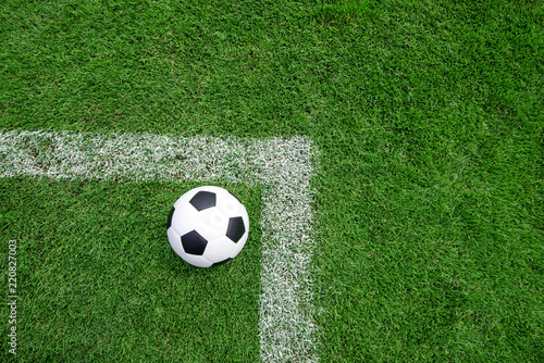 football field ball on green grass , soccer field background texture