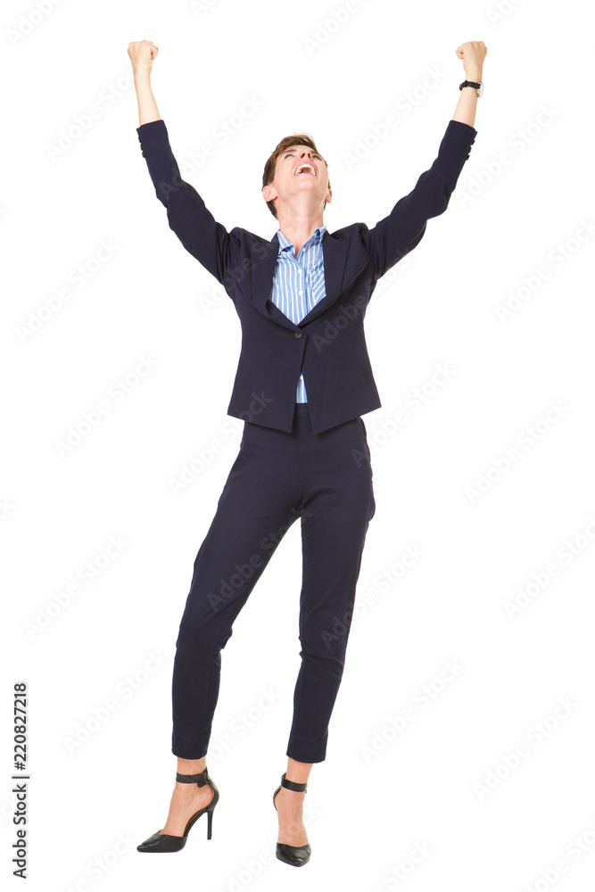 Full length businesswoman cheering with arms raised Full length businesswoman cheering with arms raised