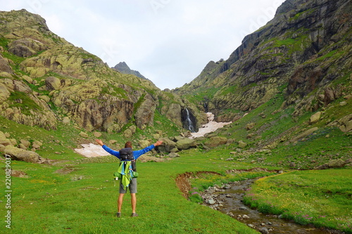 Hiking trail with a young man leading to Tobavarchkhili pass in Caucasus Mountains in Georgia on a hike to Silver Lakes photo