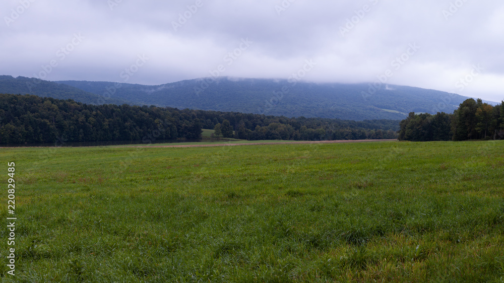 Panoramic view of field and mountains