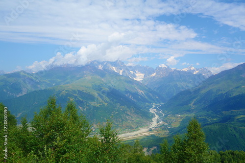 Peak of mount Ushba covered in clouds in Caucasus mountains, Upper Svaneti region, Georgia