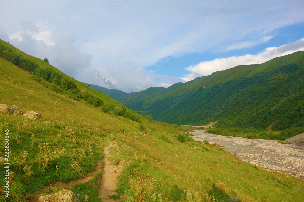 Colorful valley during sunset on a hiking trail leading from Mestia to Ushguli, Georgia