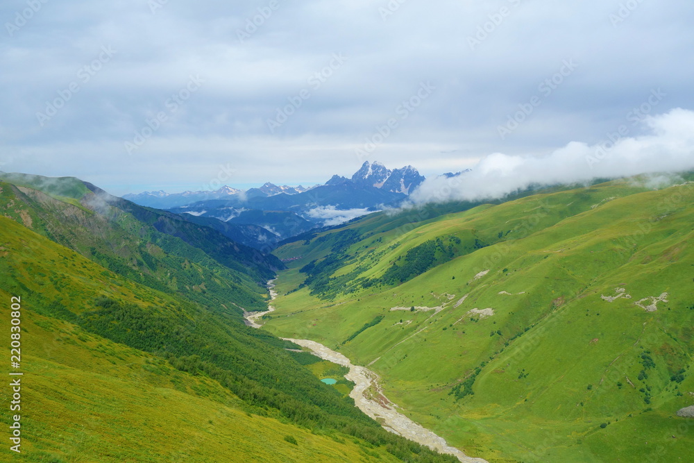 View from Chkhunderi mountain pass to valley and Khaldechala river in the summer in Svaneti region, Georgia