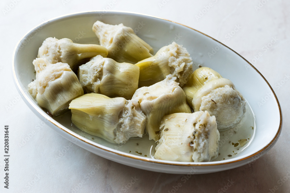 Pickled Artichoke Hearts Pickle Marinated in Plate. Pickled Artichoke Hearts Pickle Marinated in Plate.