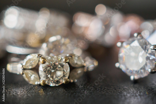 Jewelry diamond rings on black background close up