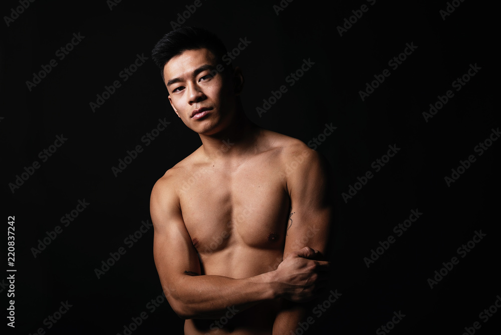 Naklejka premium Portrait of young asian boy with fitness body