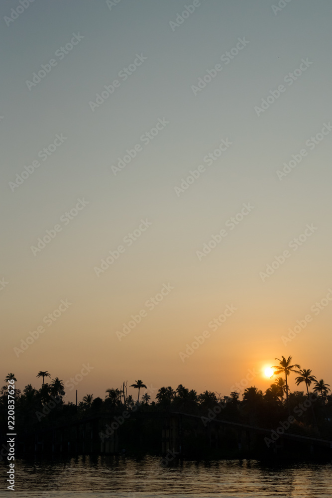 Beautiful sunset view from a boat ride at Alappuzha, Kerala, India Beautiful sunset view from a boat ride at Alappuzha, Kerala, India
