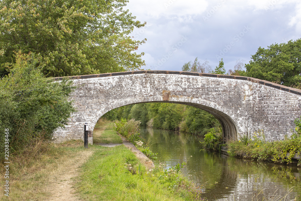 Arch bridge on the Trent and Mersey canal in Cheshire England UK