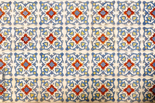 Mosaic of colourful ornate floral ceramic tiles typical of designs found on the frontage of traditional Chinese peranakan shop houses 