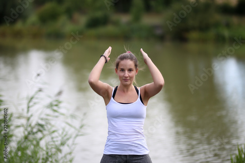 Yoga exercises outdoors   A young girl   Portrait