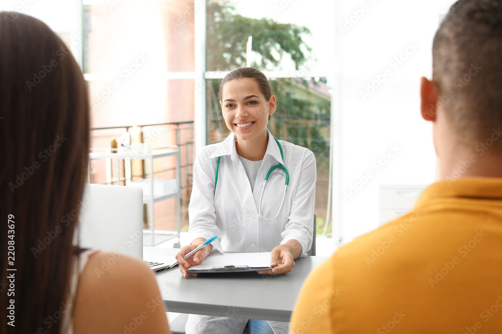 Doctor talking to her patients in hospital Doctor talking to her patients in hospital