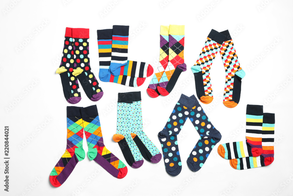 Obraz premium Flat lay composition with different colorful socks on white background