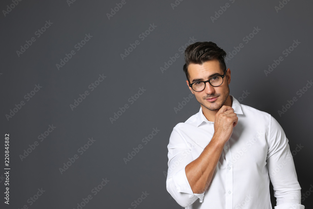 Portrait of handsome young man and space for text on black background Portrait of handsome young man and space for text on black background