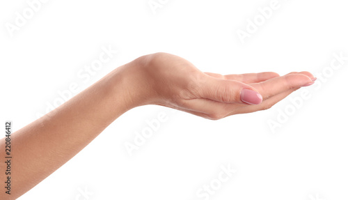 Woman holding hand palm up on white background, closeup