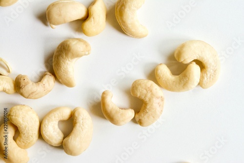 Tasty raw white cashew nuts on the white background