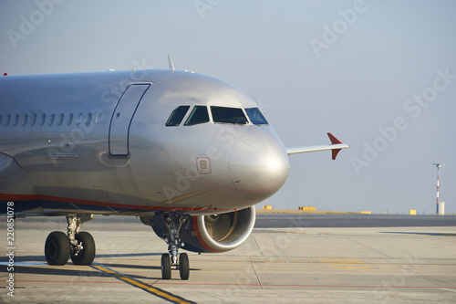 Traffic at the airport. Airplane is taxiing to the runway.