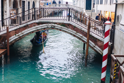 Gondolas on lateral narrow Canal, Venice, Italy. photo