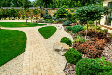 Fotobehang Beige A country house with a beautiful backyard behind the house, landscape design  © white78