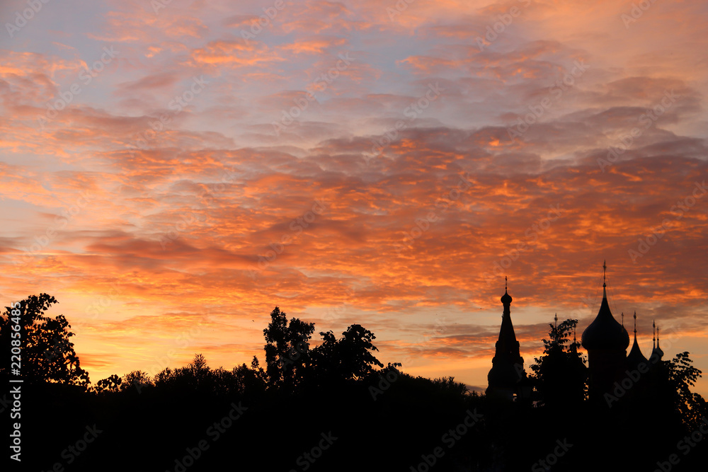 Obraz premium Church Of Our Lady Of Tikhvin. The Church Of St. Nicholas. Silhouettes in the light of sunset. Yaroslavl.