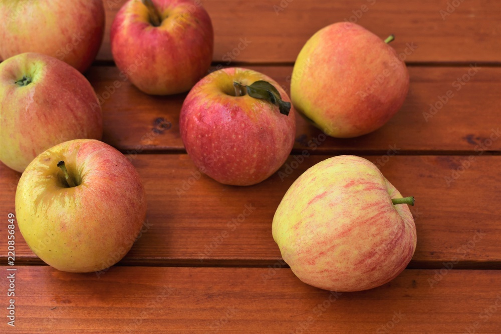 Ripe apples on a wooden table, autumn harvest concept. Ripe apples on a wooden table, autumn harvest concept.