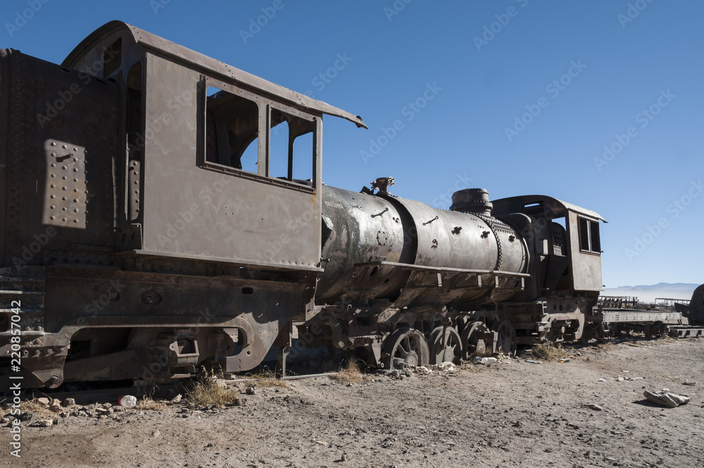 Rusty old and abandoned trains at the Train Cemetery (Cementerio de Trenes) in Uyuni desert, Bolivia - South America