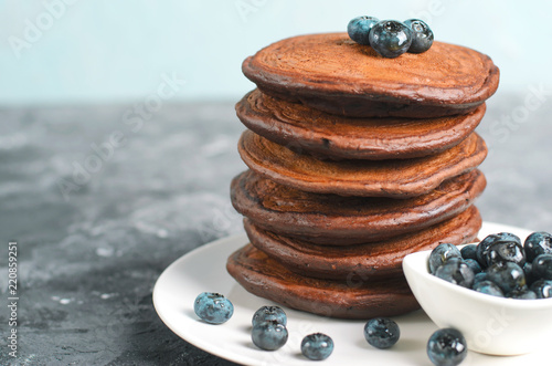 Chocolate Pancakes with Blueberry on grey background, Homemade Dessert, Sweet Breakfast