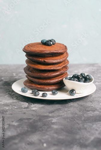 Chocolate Pancakes with Blueberry on grey background, Homemade Dessert, Sweet Breakfast