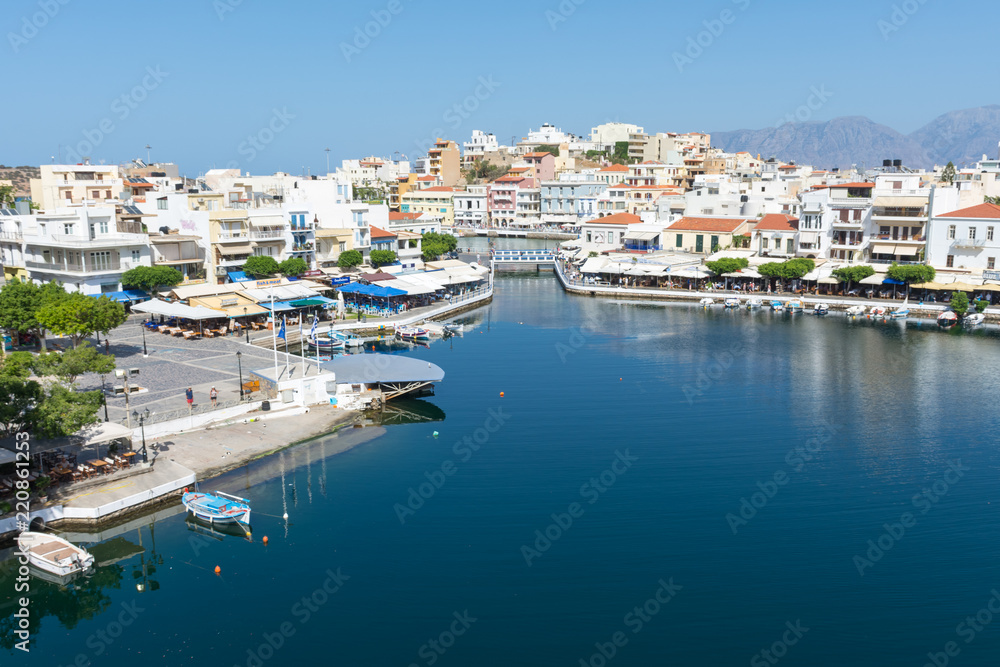 Agios Nikolaos. Crete. View to Lake Voulismeni. Boats at the pier.