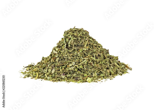 Fotografie Mixed italian herb seasoning on a white background