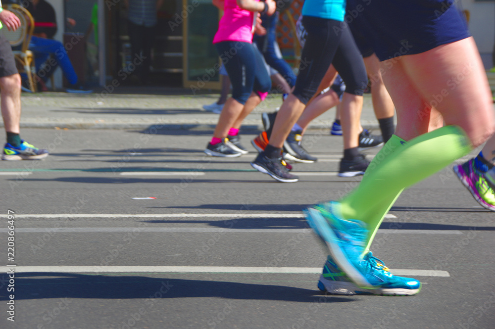 Marathon runner's feet and sport shoes, a fitness and healthy lifestyle concept.