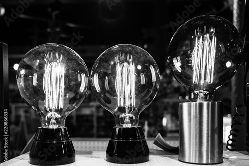 Quadro su tela Close up of three litten light bulbs