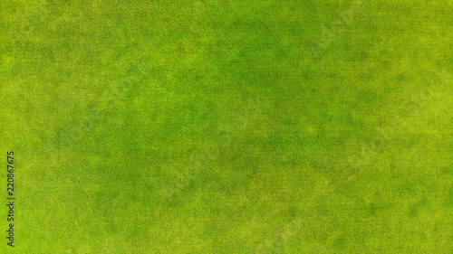 Aerial. View above of a green grass texture background.