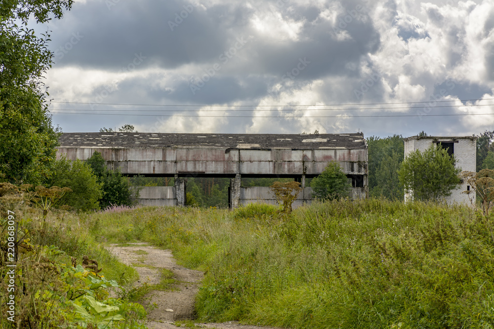 Abandoned agricultural buildings near the village of Muya in the Leningrad region.