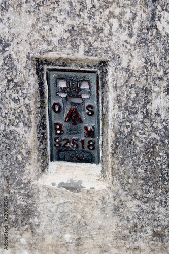 Canvastavla The Ordnance Survey Bench Mark on the side of a British triangulation point, or