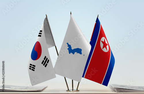Foto Flags of South Korea and North Korea with a Korean Unification flag in the middl