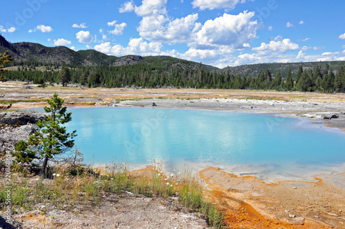 A turquoise blue geothermal pool at Yellowstone
