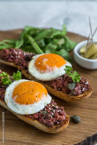 Beef tartare with pickled fried egg on top.