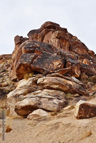A pile of rocks with petroglyphs carved into them