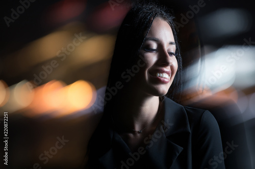 Smiling unusual woman in night city