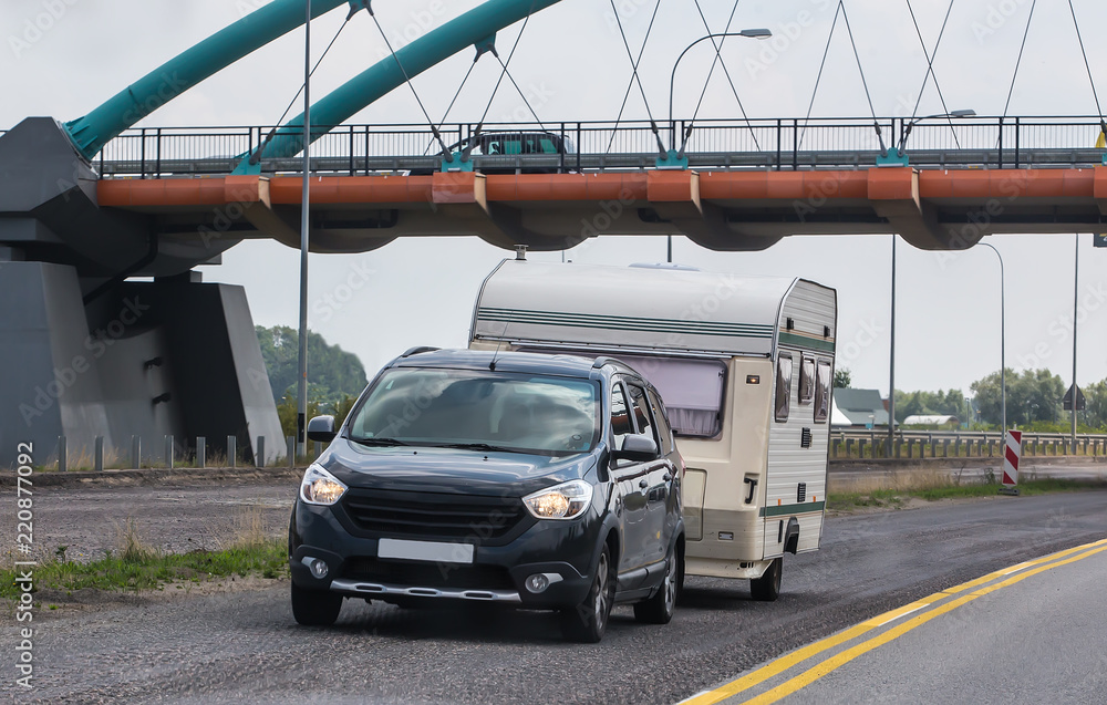 Naklejka premium car with a camping trailer