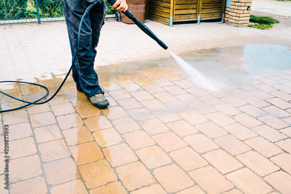 Outdoor floor cleaning with high pressure water jet - cleaning concrete  block floor on terrace foto de Stock | Adobe Stock