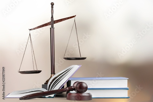 Justice Scales and books and wooden gavel on table. Justice