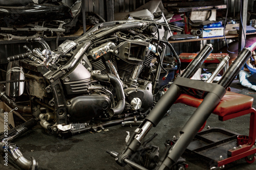 Professional auto repair service in the process of repairing a motorcycle.