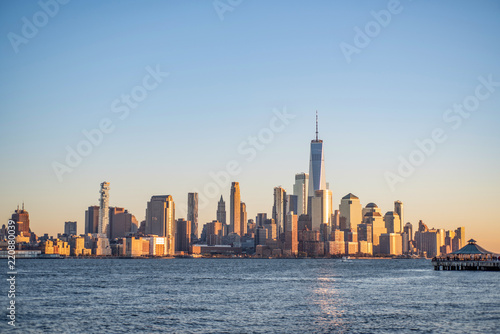 New York Skyline Downtown  Financial district  Manhattan in Morning sunrise lights view. Famous location on blue sky background.