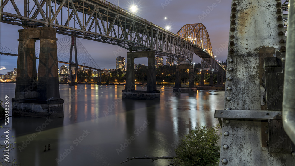 Patullo Bridge, Surrey, British Columbia, Canada. Long exposure of the bridge over the water. Sky Train Bridge.