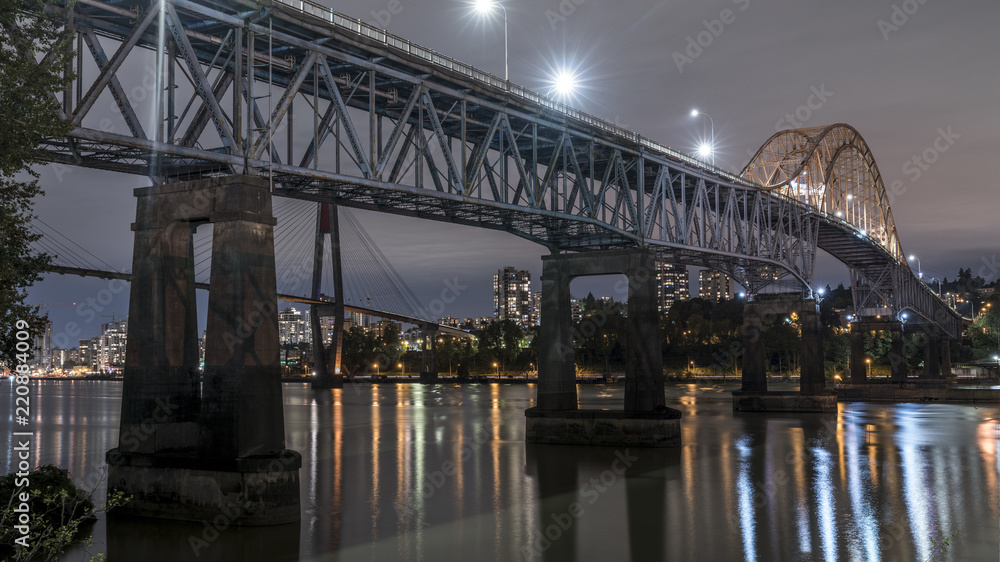 Patullo Bridge, Surrey, British Columbia, Canada. Long exposure of the bridge over the water. Sky Train Bridge.